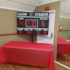 a red table with a score board on it