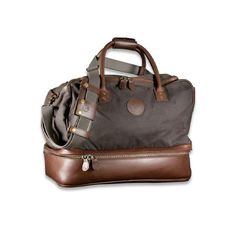 A finely appointed luxury vegetable tanned bridal leather and waxed twill canvas weekend classically styled duffle with durable solid brass hardware a, this travel gear has a spacious top compartment that holds all the weekend necessities and a lined bottom compartment for shoes and dirty laundry. Classic Weekender Bag With Leather Lining For Overnight Trips, Classic Waxed Finish Duffle Bag For Business, Classic Business Duffle Bag With Waxed Finish, Classic Weekender Bag With Leather Handles For Overnight Trips, Classic Duffle Bag With Luggage Sleeve In Coated Canvas, Classic Travel Bag With Luggage Sleeve And Coated Canvas, Classic Weekender Bag For Overnight Trips With Waxed Finish, Leather Weekender Bag With Canvas Lining For Overnight Trips, Travel Bags With Leather Lining And Canvas Material