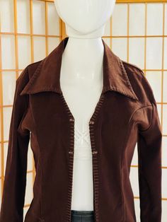 "Really cute faux suede / vegan leather / animal friendly jacket that's super flattering!  This treasure's attractive cut drapes close to the body -- it doesn't have a boxy, square cut like many vintage blazer jackets have.  Great Details: Long collar, cute side pockets,  braided whipstitch edging, etc.  Beautiful rich chocolate brown neutral material compliments any color or pattern you wear underneath.  Has a country western / cowboy vibe to it.  Inspired by the amazing suede jackets craze of the 1970s.   Unisex adult / gender neutral.  💥Vintage Label: Evolution Not Revolution 💥Vintage Label Size: S  💥Condition: Excellent vintage.  Please see measurements before buying.  💥MEASUREMENTS💥 Measurements are taken while the garment is lying flat. Please double where appropriate for actual Leather Jacket With Suede Overlays And Long Sleeves, Fitted Brown Leather Button-up Jacket, Fitted Brown Leather Jacket With Collar, Fitted Brown Leather Collared Jacket, Spring Leather Jacket With Suede Overlays, Spring Long Sleeve Leather Jacket With Suede Overlays, Brown Suede Overlay Outerwear For Fall, Fitted Suede Outerwear With Overlays, Fitted Suede Outerwear With Button Closure