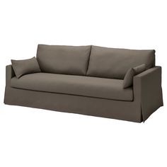 a gray couch with two pillows on the back and one arm folded up to it's side