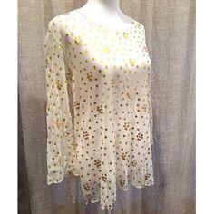 New With Tags. Never Worn. Excellent Condition. This Sheer, Sparkling Ivory Top With Gold Sequins Is Ready For Your Next Party! I Believe It Is Vintage But Am Unsure. There Is No Label In The Top To Verify. I Did A Google Image Search And Found Nothing Like It. It Is Gorgeous!!! Size Note: The Price Tag On This Top Indicates It’s A Size Xs. However, It Appears To Be Too Large To Be An Extra-Small. The Chest Measures Approx. 19” Across And The Length From Shoulder To Bottom Is Approx. 24-1/2”. See Measurements In Photos. Please View All Photos Of Item As They Are Part Of The Description. Please Contact Me With Any Questions Before Purchase. I'm Happy To Answer All Questions! Size: X Summer Embroidered Gold Tops, Gold Embroidered Summer Tops, Embroidered Gold Tops For Summer, Spring Embroidered Gold Top, Embroidered Gold Top For Spring, Gold Embroidered Top For Spring, Cream Tops For Spring Festivals, Cream Top For Spring Festivals, Cream Festive Tops For Spring