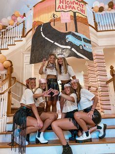 the girls are posing on the stairs in front of a sign that says high school alhacin