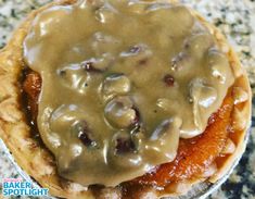 a pastry with gravy on top of it