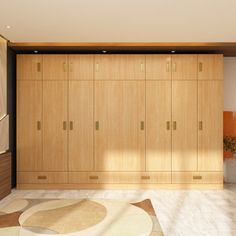 an empty room with wooden cabinets and rugs on the floor in front of it