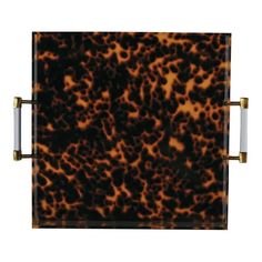 a brown and black animal print tray with two handles on each side, in front of a white background