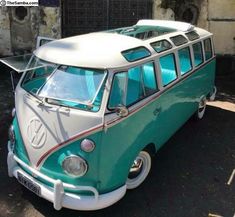 an old vw bus parked in front of a building