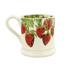 a white coffee cup with strawberries on it