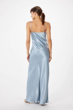 Experience the timeless presence of elegance with the SOPHIE RUE Ella Satin Slip Maxi Dress. Crafted with luxuriously soft satin, this slip dress moves with graceful fluidity and features adjustable spaghetti straps, a V-neckline, and a high slit for a flash of skin. Fully lined with a bias cut, this classic design will lend effortless grace to any affair - casual or formal. ** Sizing notes: This style runs TTS. Model is 5'8" and wearing a size S. MATERIALS: 53% Rayon 47% Viscose CARE: Hand wash