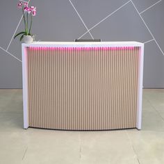 a flower pot sitting on top of a counter