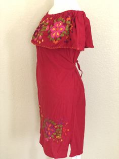 "Mexican Off the shoulder tie back dress. With beautiful hand embroidery.Made out of manta, 100% cotton. Color: Red/ Multicolored embroidery. Size- Medium Dimensions: Bust- 43\" Hips- 43\" Waist- 43\" Length- 31\" 🧵Made in Chiapas, Mexico. 🧺Care Instructions: We recommend hand washing, lay flat to dry. 📲Please feel free to message me with any questions regarding sizing and fit. 📷Additional photos can be provided upon request. 👗Always allow a little room and consider your own measurements be Embroidered Off-shoulder Dress For Vacation, Bohemian Red Off-shoulder Dress, Red Bohemian Off-shoulder Dress, Bohemian Off-shoulder Dress With Floral Embroidery, Peasant Style Red Embroidered Dresses, Embroidered Dresses For Fiesta And Festivals, Bohemian Embroidered Off-shoulder Summer Dress, Bohemian Off-shoulder Embroidered Summer Dress, Red Embroidered Sundress