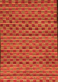 an orange, brown and black rug with squares on the bottom half is shown in front of a white background