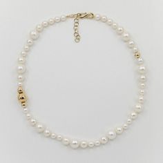 Crafted from freshwater pearls interspersed with gleaming 14K gold spheres, Mapperri’s Bubble & Gold Pearl Necklace is anything but understated. Its bold design features a unique arrangement of graduated pearls, creating a striking look that captures attention. The adjustable length makes it versatile for different necklines. Made with freshwater pearls and recycled 14K yellow gold. Freshwater pearl 14K yellow gold, recycled  Pearls are delicate and should be worn regularly to maintain their lus Different Necklines, Forever Jewelry, Gold Pearl Necklace, Jewelry Ring Box, Men's Jewelry Rings, Bold Design, Watch Necklace, Gold Pearl, Jewellery Boxes