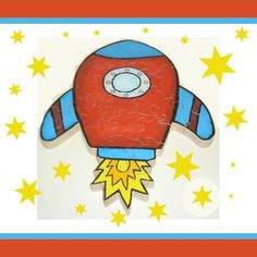 a red and blue paper toy with stars around it