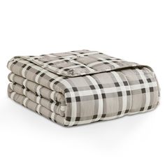 four blankets stacked on top of each other in grey and white checkered fabric,