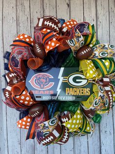 the green bay packers football wreath is decorated with polka dot bows and an official team logo