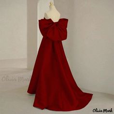 Olivia Mark - Red Bridal Gown with Bow Tie Detail for Engagement Ceremony Red Bridesmaid Ball Gown, Red Ball Gown For Bridesmaid, Holiday Floor-length Gown With Sweep Train, Red Satin Bridesmaid Gown, Red Floor-length Bridesmaid Evening Dress, Red Satin Christmas Dress, Red Gown For Christmas Formal Occasion, Red Evening Dress With Red Bow, Red Evening Dress With Bow