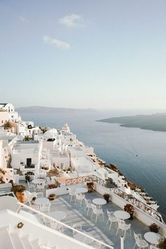 an aerial view of white buildings and the ocean