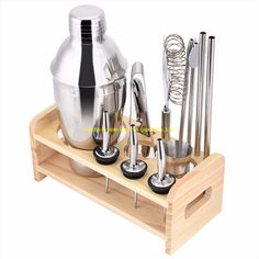 an assortment of kitchen utensils on a wooden tray