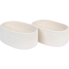 two white rope baskets sitting on top of each other