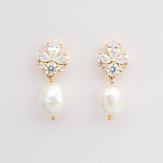 GISELLE Mini // Gold bridal pearl drop earrings - A smaller version of our best selling Giselle earrings. An elegant pair of gold cubic zirconia earrings with clear cz crystals and freshwater pearls on a gold plated finish. 14k gold plated 925 sterling silver. Due to their natural form, pearls will vary in size and shape.  Total length approx 2.3cms Pearl approx 1cms Please note, that for hygiene reasons earrings cannot be returned. White Dainty Cubic Zirconia Bridal Earrings, Dainty White Cubic Zirconia Bridal Earrings, Minimalist Drop Earrings For Wedding, Delicate Cubic Zirconia Bridal Earrings With Pearl Drop, Dainty Bridal Pearl Drop Earrings, Minimalist Cubic Zirconia Wedding Earrings, Dainty Pearl Drop Earrings With Cubic Zirconia, Dainty Drop Bridal Earrings For Wedding, Dainty Drop Bridal Earrings