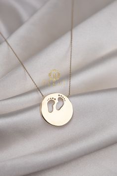 "ABOUT PRODUCT This 14K Gold Footprint Necklace is beautifully designed and hand crafted with our associates to make this a special gift for your loved ones. Knowing the value of our customers, We prepare each piece with extra care and attention. ITEM DETAILS Material: 14K Gold Approx: 4.75 gram  Available colors: Gold, Rose Gold, White Gold Available Sizes: 14\" to 20\" ✪ 14k Solid Gold ( Certification will be included with your order ) ✪Available 14K White, Yellow, Rose Gold (also in 10, 18K) Minimalist 14k Stamped Jewelry Gift, Personalized Minimalist Keepsake Jewelry, Minimalist Personalized Keepsake Jewelry, Minimalist Handmade Necklace For Keepsake, Minimalist Keepsake Jewelry For Mother's Day, Minimalist Round Keepsake Jewelry, Minimalist Handmade Keepsake Necklace, Minimalist Keepsake Jewelry, Customized Minimalist Necklace With Round Pendant