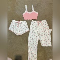 Adorable Pink Floral Pajama Set. Size Xs. Never Worn, In Perfect Condition! No Holes, Stains, Etc. Comes With Shirt, Shorts, And Pants. Super Soft And Comfortable Material! Stretchy Material As Well, So It Can Fit Larger Sizes! Lace Detailing On Shirt, And Pink Lined Ruffles On Bottom Of Shorts And Pants. Extremely Comfy While Also Looking Super Cute! Offers Always Welcome! Add Two Or More Items To Your Bundle For 10% Off!! If You Have Any Questions, Leave A Comment:) ****Fast Shipping!! Casual Loungewear Sets With Lace Trim, White Casual Sets With Lace Trim, Feminine White Sets For Sleepover, White Sleeveless Sleepover Clothing Set, White Sleeveless Sleepover Set, White Feminine Vacation Sets, Feminine White Sets For Vacation, White Sets With Lace Trim For Pajama Party, Feminine White Vacation Sets