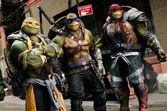 the teenage mutant ninjas are walking down the street