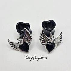 🖤You'll Receive One Pair Of These Drop/ Dangle Tunnels: All Silver Finish With Black Gem Inside An Angel Wings & Heart Pendant. Tunnels Were Designed To Be Hider Gauges For Work Or For Any Occasion Your heart desires. We Specialize In Gorgeous Jewelry For Stretched Ears. 🖤MATERIALS USED VARIES DEPENDING ON YOUR PLUG SIZE! ↓ Sizes 0g-1/2": Will Be Done In ACRYLIC DOUBLE FLARED Tunnels ◼️Sizes Available Are 0g (8mm) , 00g (10mm), 1/2"(12mm)9/16" (14mm), 5/8 (16mm), 3/4 (18mm), 13/16" (20mm), 7/8 Black Heart Earrings For Pierced Ears As Gift, Black Heart Earrings As A Gift, Black Nickel-free Jewelry For Valentine's Day, Nickel-free Black Jewelry For Valentine's Day, Gothic Black Heart-shaped Earrings, Nickel-free Black Heart-shaped Jewelry, Nickel-free Black Heart Jewelry, Black Heart Earrings With Heart Charm For Gift, Black Heart Charm Earrings For Gift