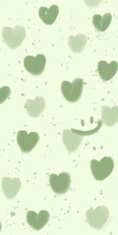 hearts are floating in the air on a white background with green and black spots around them