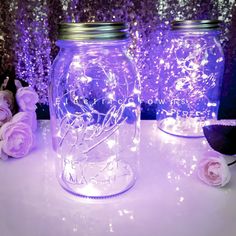 there is a mason jar with lights in it