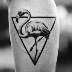 a flamingo tattoo is shown on the thigh and leg, with an inverted triangle behind it