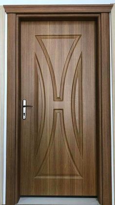 a wooden door with a decorative design on it's side panel and the letter h