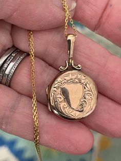 "A beautiful antique 9ct Yellow Gold gold locket Circa 1860 from UK  The locket tested and confirmed the outer case and inner compartment is 9ct gold. The hinges are brass for strength which was customary at that time.  The case is circular with beautiful engraved decor to both sides; very sentimental in design...room for engraving... It likely served as a 'mizpah' style, sweetheart locket for loved ones who had to be parted for a time. Long bale which is unique in design I added an 16\" Vermeil Antique 14k Stamped Medallion Locket Necklace, Antique Yellow Gold Locket Necklace For Keepsake, Victorian Yellow Gold Medallion Locket Necklace, Victorian Locket Necklace Stamped 14k, Victorian Yellow Gold Locket Necklace Keepsake, Victorian Yellow Gold Locket Necklace For Keepsake, Victorian 14k Stamped Round Locket Necklace, Antique Yellow Gold Locket Necklace, Victorian Yellow Gold Locket Necklace