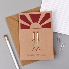 the perfect match notebook with pen and notepad next to it on top of a desk