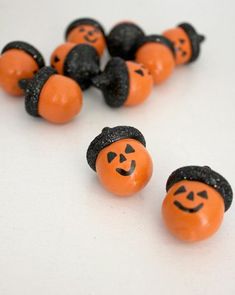 several orange and black pumpkins with faces on them