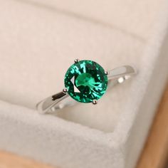 Classic Solitaire Emerald Promise Ring, Classic Green Jewelry For Promise Occasions, Elegant Green Topaz Ring In Sterling Silver, Elegant Green Topaz Promise Ring, Classic Emerald Ring For Promise, Classic Solitaire Diamond Ring For May Birthstone, Classic Emerald Promise Ring, Classic Diamond Ring With May Birthstone, Green Topaz Ring In Sterling Silver