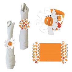 an orange and white table setting with place cards, napkins, and paper pumpkins