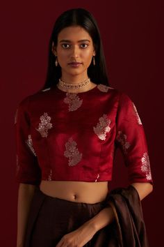 Red round neck blouse with floral brocade woven motifs. Components: 1 Pattern: Woven Type Of Work: Floral Neckline: Round Sleeve Type: Half sleeves Fabric: Brocade, Lining: Shantoon Color: Red Other Details:  Length: 5.5 mtrs Model height: 5ft 9inches, wearing size M Note: Blouse worn by the model is not for sale Disclaimer: Since all our products are sustainable, touched by human hands be it weaving, block printing, or embroidery, there might be slight imperfections that make them unique and in Red Saree Blouse, Banarasi Brocade, Saree Blouses Online, Brocade Blouses, Saree Blouses, Fancy Blouses, Fancy Blouse Designs, Blouse For Women, V Neck Blouse