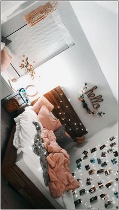 a bedroom with pink and white decor on the walls