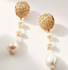 For the woman whose aesthetic is beachy boho-glam - these darling dangles are for you! By pairing rhinestones, pearls, and raffia drop - we've incorporated a few of our favorite things to create the Delphine Drops Summer Gold Jewelry With Dangling Beads, Elegant Natural Drop Earrings, Vintage Drop Earrings For Summer, Chic Beaded Jewelry For The Beach, Natural Drop Earrings For Summer, Elegant White Pearl Earrings For Summer, Chic Dangle Jewelry For Beach, Chic Dangle Jewelry For The Beach, Elegant Summer Earrings With Dangling Beads