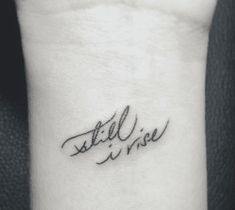 a small wrist tattoo with the words still in wise on it