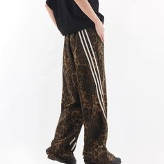 Indulge in the latest fashion trend with our Trending Leopard Print Sweatpants. Made with luxurious materials, these sweatpants exude sophistication and exclusivity. Upgrade your wardrobe with these stylish sweatpants, perfect for lounging or making a statement on the streets. Elevate your style with the touch of leopard print. Features: -85% Polyester -Adjustable Waistband -Solid Color -MId-rise waist -Regular fit Stretch Brown Pants For Streetwear, Trendy Tapered Leg Sweatpants For Streetwear, Brown Relaxed Fit Joggers For Streetwear, Trendy Sweatpants For Streetwear With Loosely Fitted Hips, Wide Leg Stretch Sweatpants For Streetwear, Stretch Wide Leg Sweatpants For Streetwear, Trendy Loosely Fitted Sweatpants For Streetwear, Brown Sweatpants For Streetwear In Fall, Brown Athleisure Pants For Streetwear