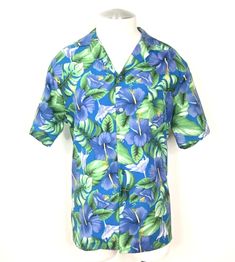 For sale is a lightly used 1970's vintage Hilo Hattie floral casual short sleeve  Hawaiian Aloha button down lightweight shirt.  100% Polyester Lightweight Original Blue Fish Eye Buttons Hibiscus, Monstera Leaf & Palm Tree Leaf Pattern Cuban Collar Left Front Pocket Straight Yoke With Side Pleats Colors In Blue, Yellow, Purple, Green & White Straight Hemline Tag Size: Extra Large(Vintage) Measurements in inches. Chest:  48 Waist:  47 Shoulder:  19 1/2 Length:  29 1/2 Will be shipped via USPS Fir Cheap Green Cotton Hawaiian Shirt, Green Hibiscus, Palm Tree Leaves, West Covina, Fish Eye, Blue Fish, Palm Tree Print, Aloha Shirt, Yellow Purple