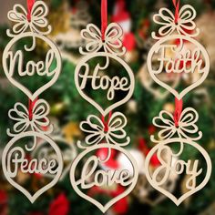 christmas ornaments hanging from a tree with the words noel, hope, and love