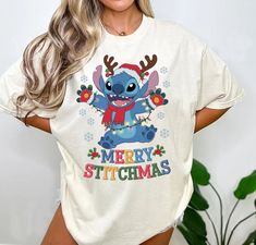 a woman wearing a merry stitchmas t - shirt