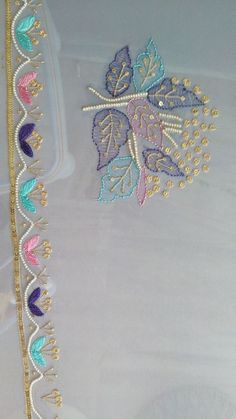 two pieces of cloth with beading on them