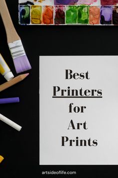 the words best printers for art prints next to paintbrushes and watercolor paints