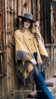 Brown Fringed Poncho For Fall, Brown Fringe Poncho For Fall, Winter Fringe Cape Outerwear, Winter Cape With Tassels, Fall Fringe Cape Outerwear, Fringe Cape Outerwear For Fall, Fall Fringe Cape Poncho, Fringed Cape Poncho For Fall, Fringe Cape Poncho For Fall