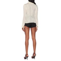 This ivory-white top from Saint Laurent will be the conversation piece at your next dinner party. With a frilly pierrot collar, poet cuffs, and golden lamé stripes throughout, it's a striking designVertical stripe patternMetallic threadingRuffled detailingLong sleevesConcealed front button fastening.96% silk, 4% metallic fibreDry clean onlyMade in France Elegant Formal Tops With Striped Collar, Elegant Formal Top With Striped Collar, Elegant White Top With Striped Collar, Luxury White Party Blouse, Chic Fitted Blouse With Striped Collar, Elegant Office Blouse With Striped Collar, Elegant Office Tops With Striped Collar, Elegant White Blouse With Striped Collar, Elegant Spring Tops With Striped Collar