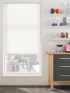 a kitchen with white walls and shelves filled with dishes, cups and utensils